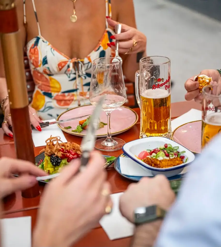 Guests sharing dishes at the table during Frank's 3-Course Menu