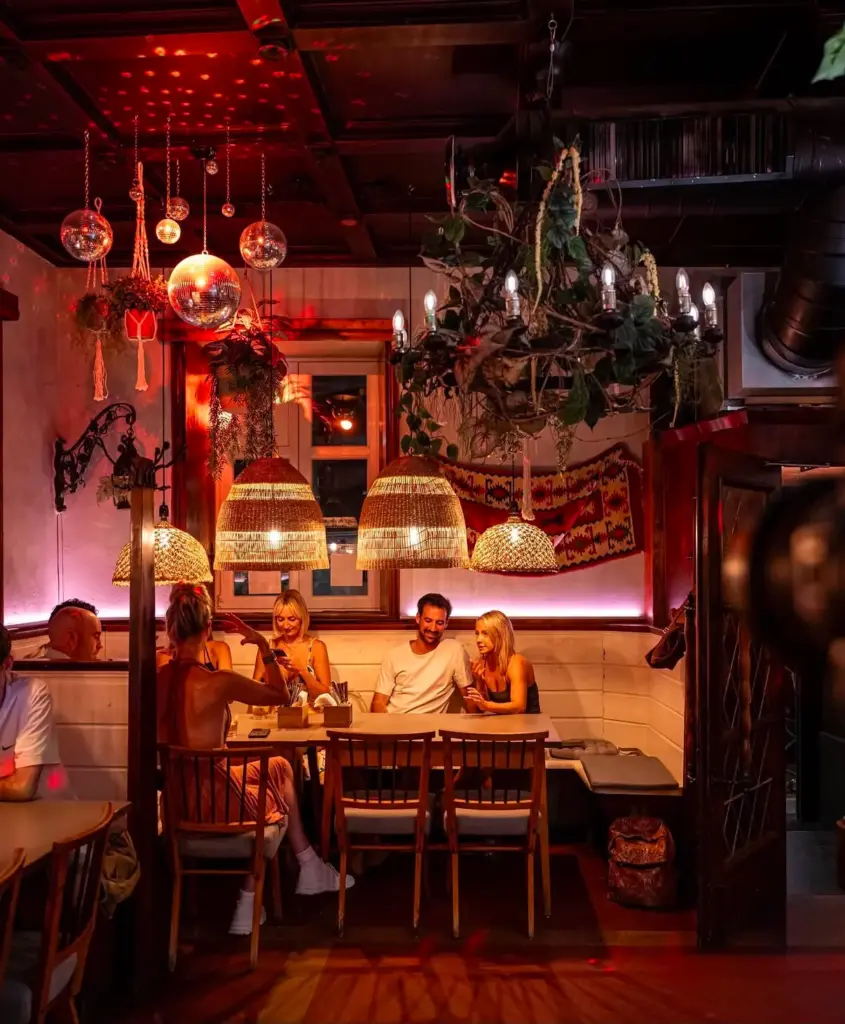 Evening atmosphere in the dimly lit restaurant and bar at Let's Be Frank, Vienna